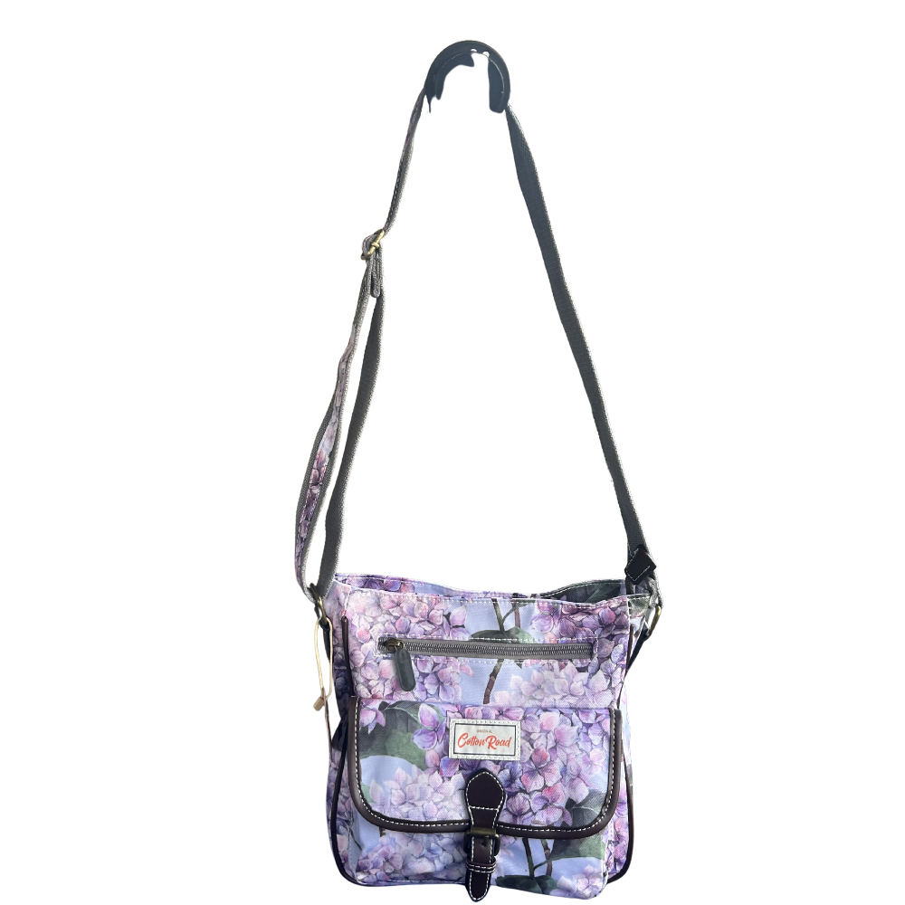COTTON ROAD SLING BAG: LIGHT BLUE FLORAL PVC SLING BAG ON SLING
