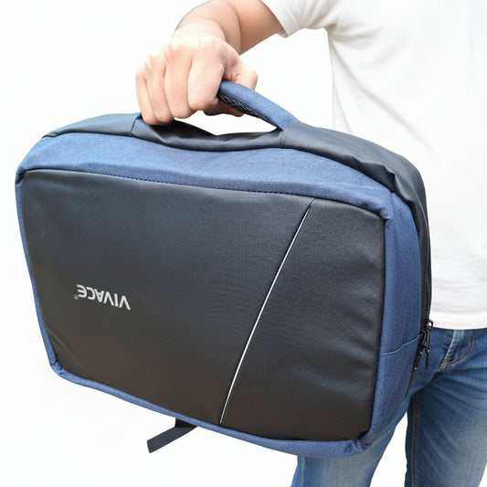 Blue and black backpack with 'VIVACE' branding held by a person on the side carry handle outdoors.