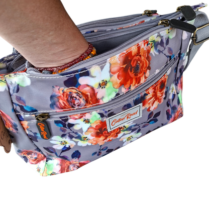Cotton Road Sling Bag: GREY PVC Triple Pocket Sling with Bright Floral Print