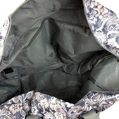 Interior view of blue PVC foldaway weekender travel bag with paisley print showing spacious main compartment and zip pockets