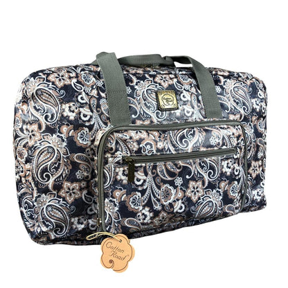 Blue PVC foldaway weekender travel bag with paisley print by Cotton Road