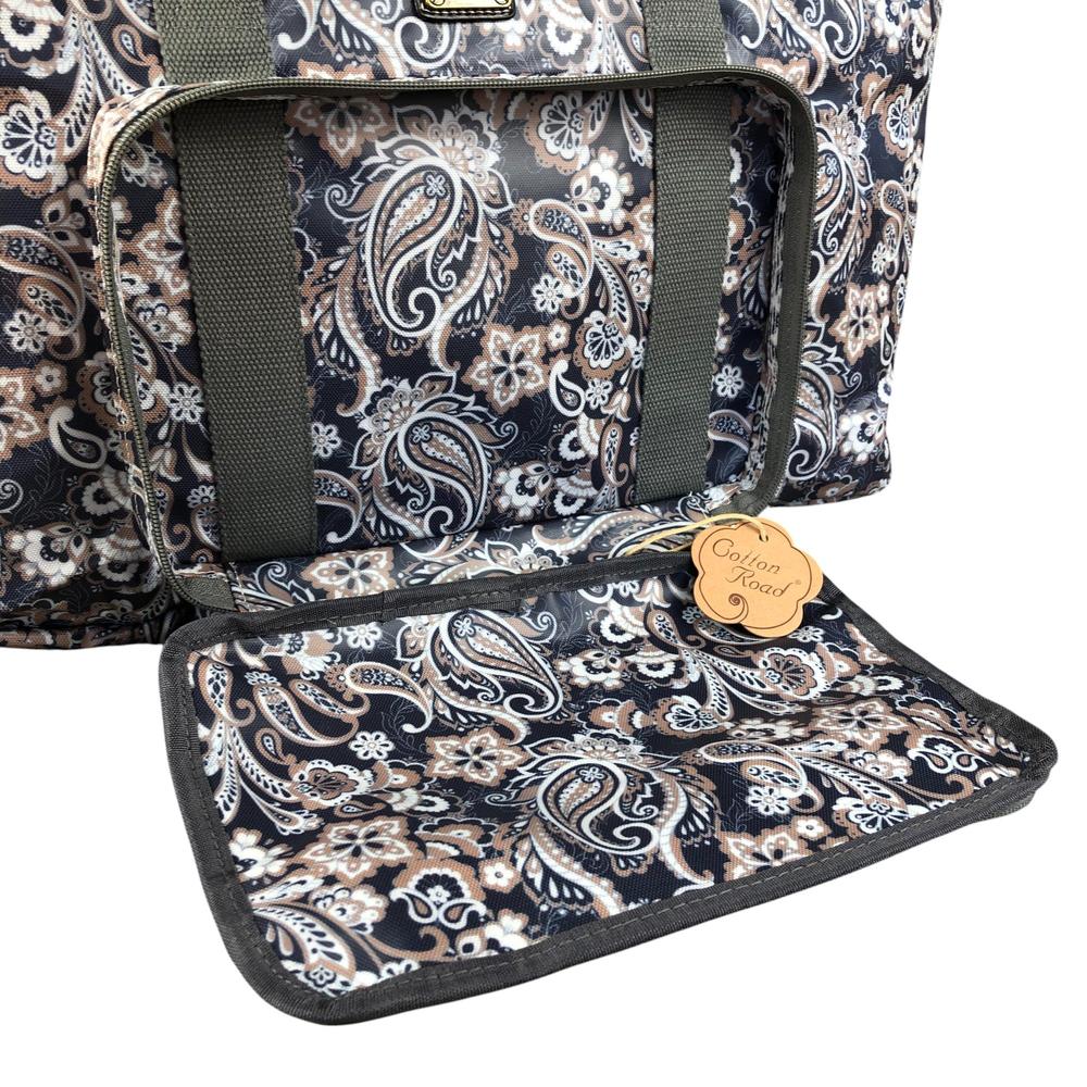 Blue PVC foldaway travel bag with paisley print by Cotton Road showing open front pocket and zip compartments