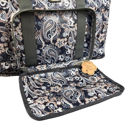 Blue PVC foldaway travel bag with paisley print by Cotton Road showing open front pocket and zip compartments