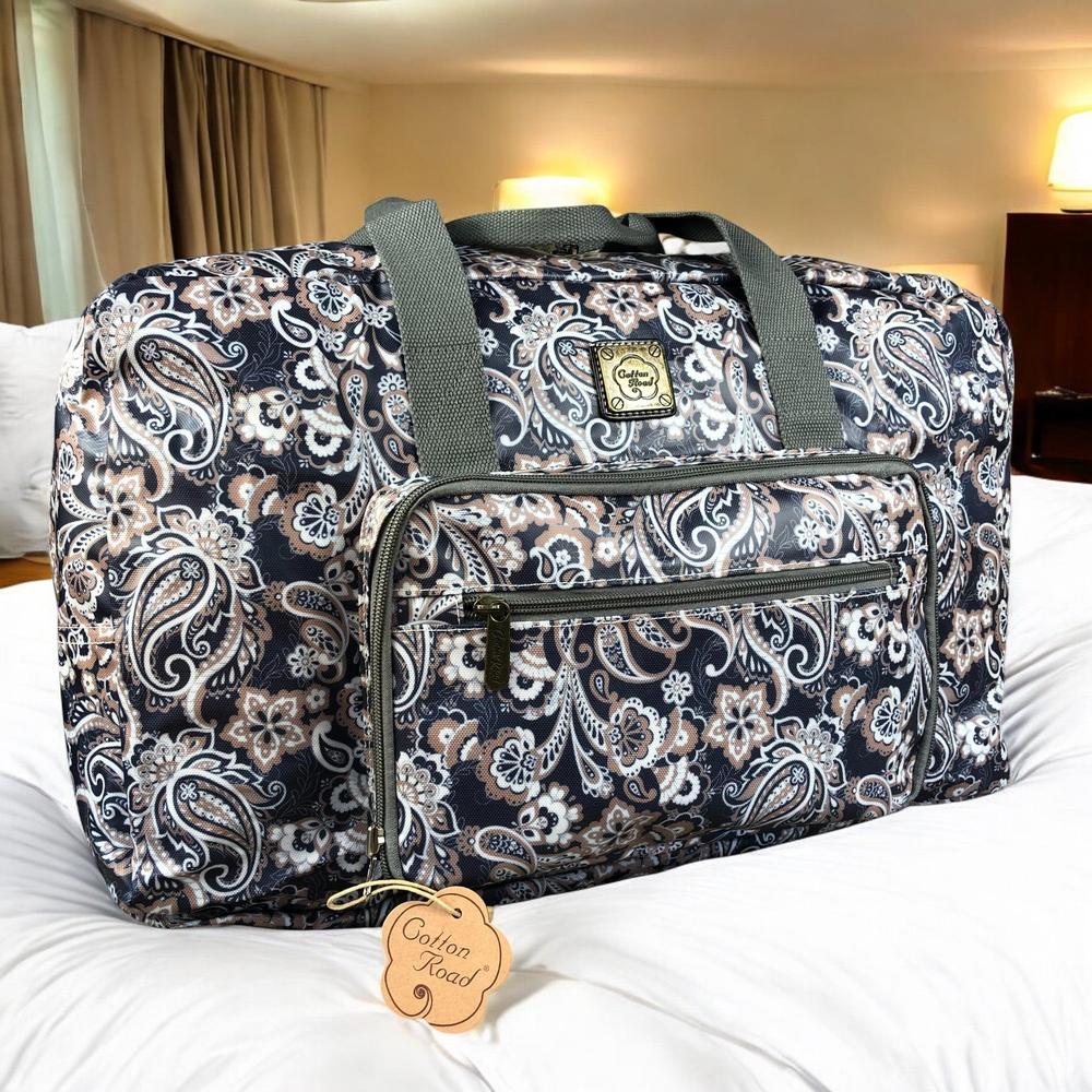 Blue PVC foldaway travel bag with paisley print, main zip and front pockets by Cotton Road
