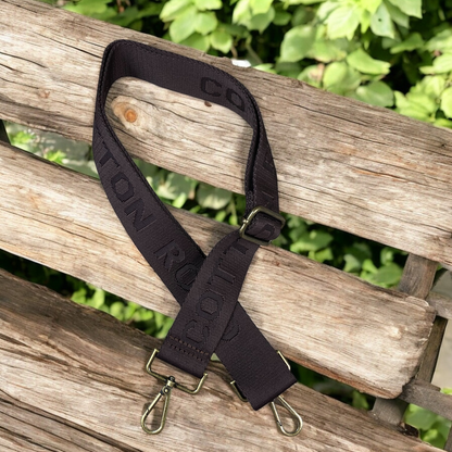 COFFEE BROWN BRANDED Cotton Road Canvas Adjustable Bag Strap on bench