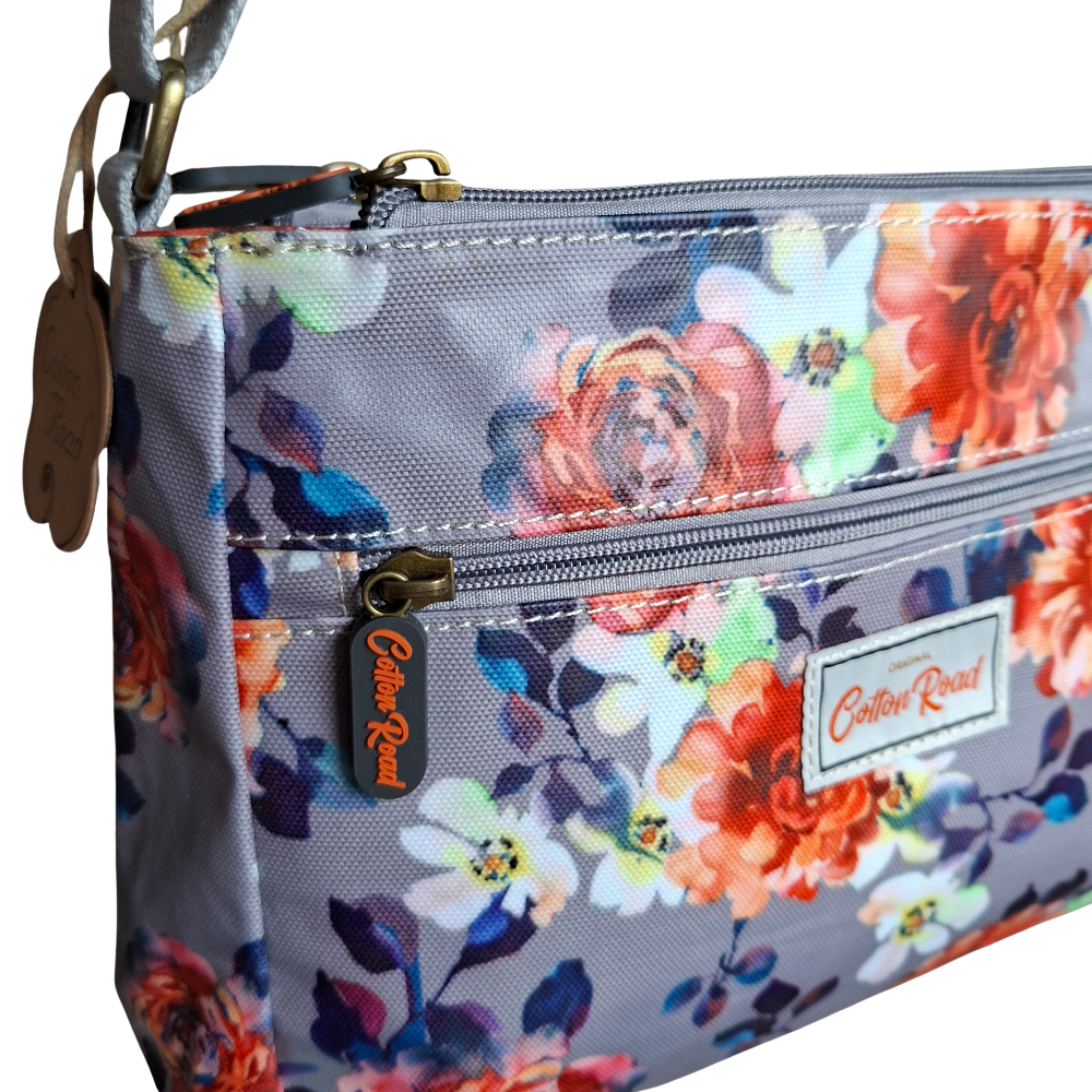 COTTON ROAD SLING BAG: GREY PVC Triple pocket Sling with Colourful floral print FRONT POCKET VIEW