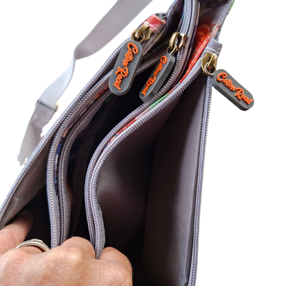 COTTON ROAD SLING BAG: GREY PVC Triple pocket Sling with Colourful floral print top zips open
