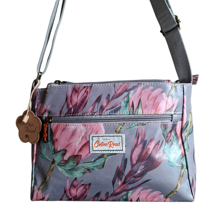 COTTON ROAD SLING BAG: GREY PVC Triple pocket Sling with Protea print front hanging
