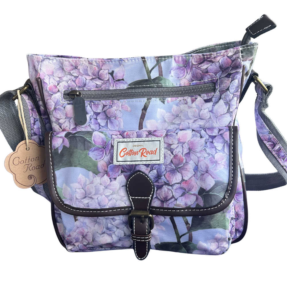 COTTON ROAD SLING BAG: LIGHT BLUE FLORAL PVC SLING BAG FRONT VIEW