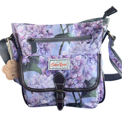 COTTON ROAD SLING BAG: LIGHT BLUE FLORAL PVC SLING BAG FRONT VIEW