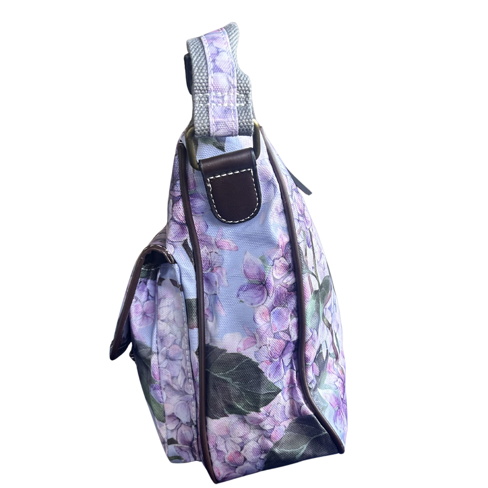 COTTON ROAD SLING BAG: LIGHT BLUE FLORAL PVC SLING BAG SIDE VIEW