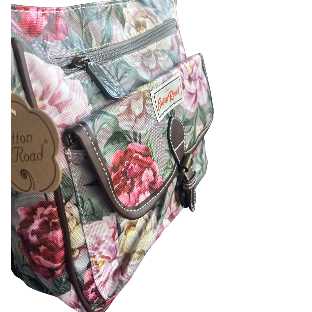 COTTON ROAD SLING BAG: MAUVE FLORAL PRINT PVC SLING BAG FRONT POCKET VIEW