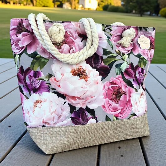 Cotton Road Beach Bag: Canvas FLORAL Bag with HESSIAN detailing. Size: L32cm x W16cm x H34cm