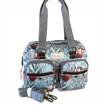 Cotton Road Handbag: TURQUOISE PVC Handbag with PROTEAS