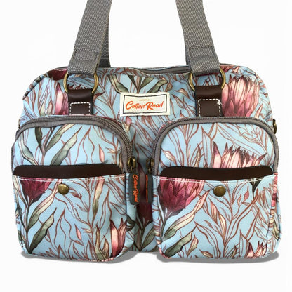 Cotton Road Handbag: TURQUOISE PVC Handbag with PROTEAS