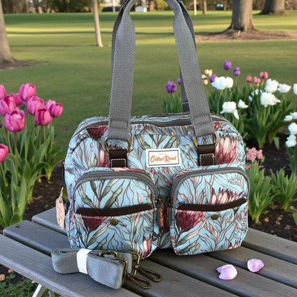 Cotton Road Handbag: TURQUOISE PVC Handbag with PROTEAS