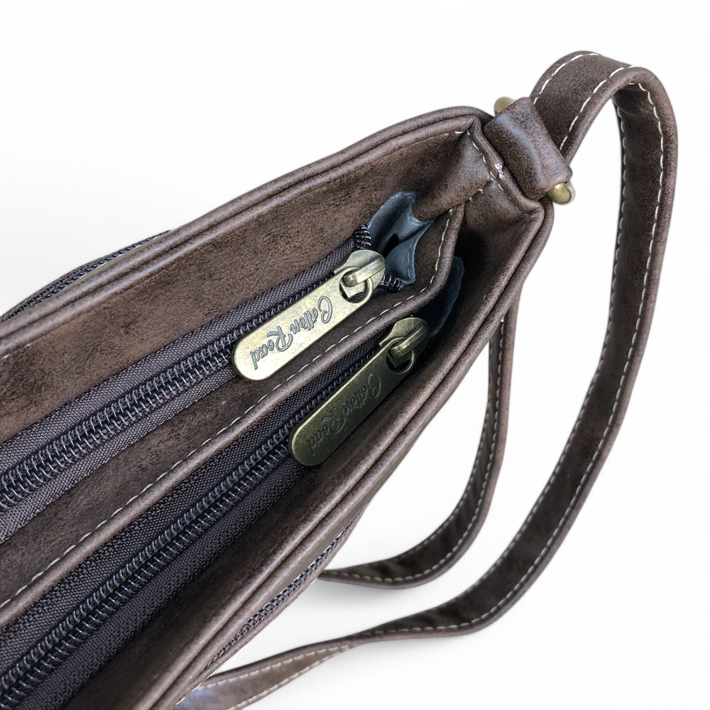 Cotton Road Sling Bag: BROWN PU Leather Sling Bag with STRAP detailing. Metal zips