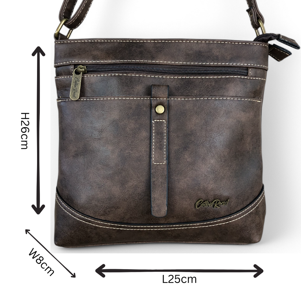 Cotton Road Sling Bag: BROWN PU Leather Sling Bag with STRAP detailing. Size: L25cm x W8cm x H26cm