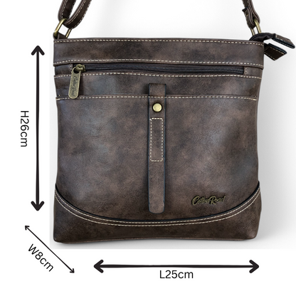 Cotton Road Sling Bag: BROWN PU Leather Sling Bag with STRAP detailing. Size: L25cm x W8cm x H26cm