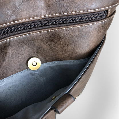 Cotton Road Sling Bag: BROWN PU Leather Sling Bag with STRAP detailing. Two exterior compartments