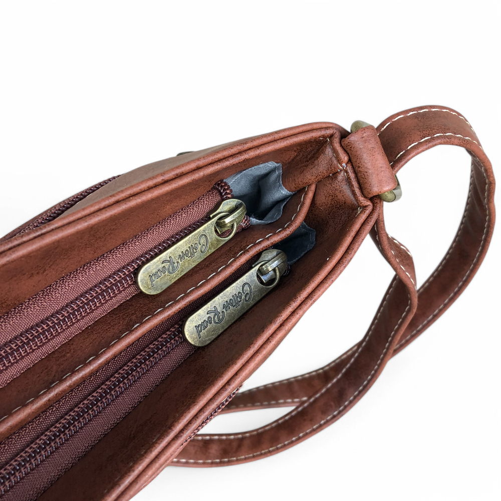 Cotton Road Sling Bag: TAN BROWN PU Leather Sling Bag with STRAP detailing. Two top zip compartments