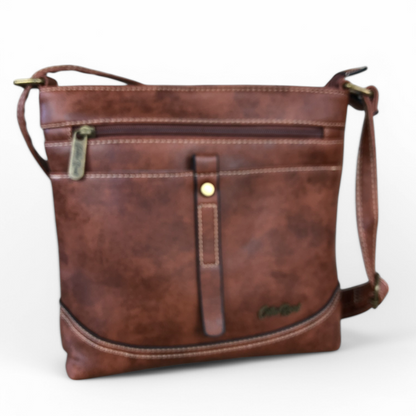 Cotton Road Sling Bag: TAN BROWN PU Leather Sling Bag with STRAP detailing. Size: L25cm x W8cm x H26cm