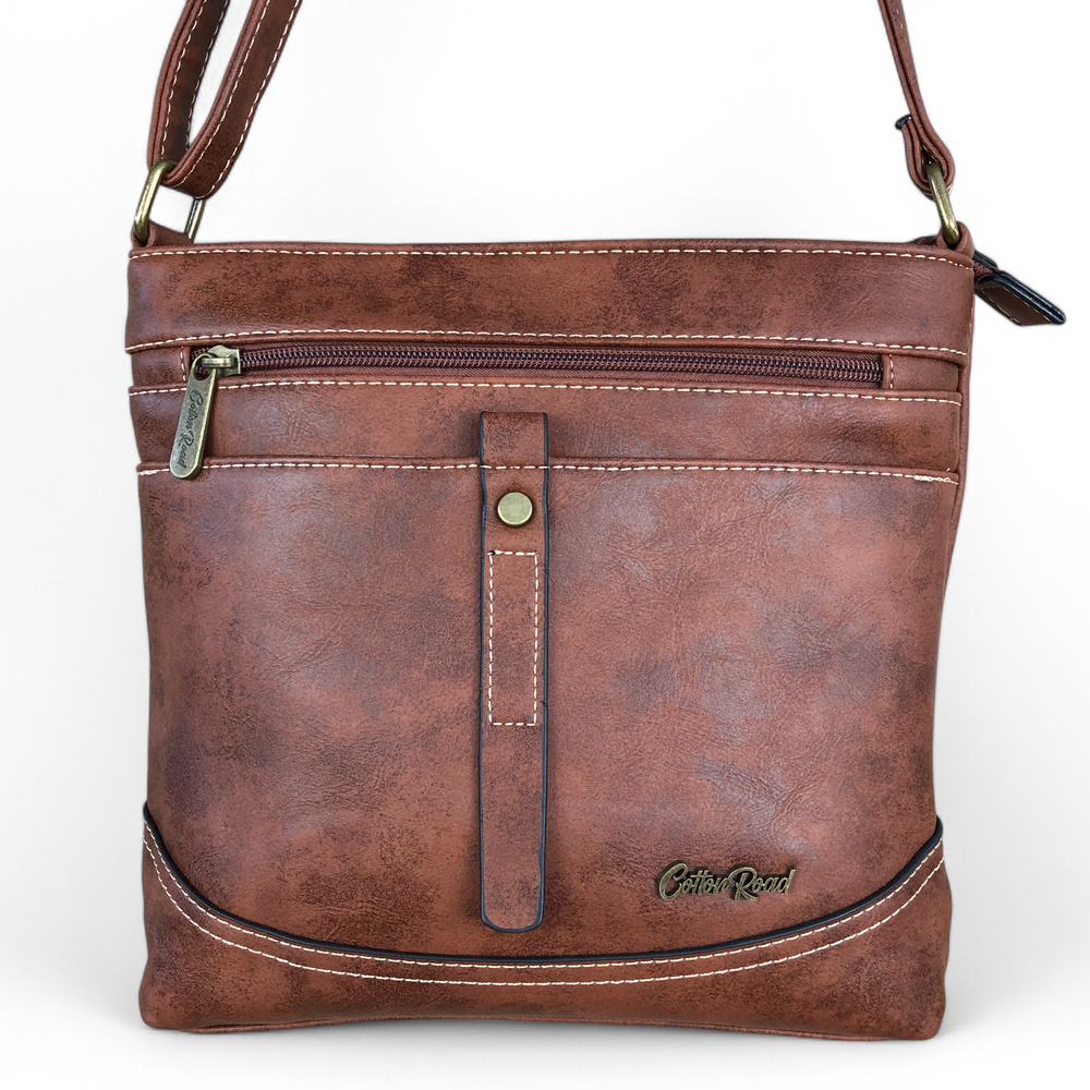 Cotton Road Sling Bag: TAN BROWN PU Leather Sling Bag with STRAP detailing. Size: L25cm x W8cm x H26cm