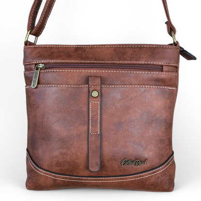 Cotton Road Sling Bag: TAN BROWN PU Leather Sling Bag with STRAP detailing. Size: L25cm x W8cm x H26cm