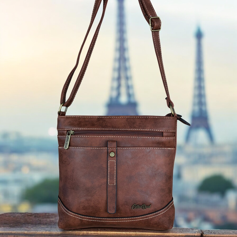 Cotton Road Sling Bag: TAN BROWN PU Leather Sling Bag with STRAP detailing. Size: L25cm x W8cm x H26cm