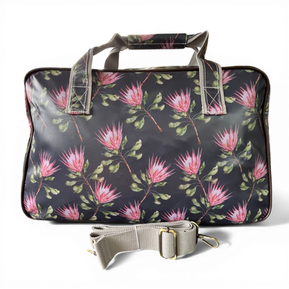 Cotton Road Travel Bag: BLACK PVC Overnight Bag with PROTEAS BACK