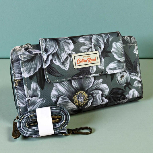 Cotton Road Wallet: Large GREEN FLORAL PVC Cellphone Sling Wallet on a table