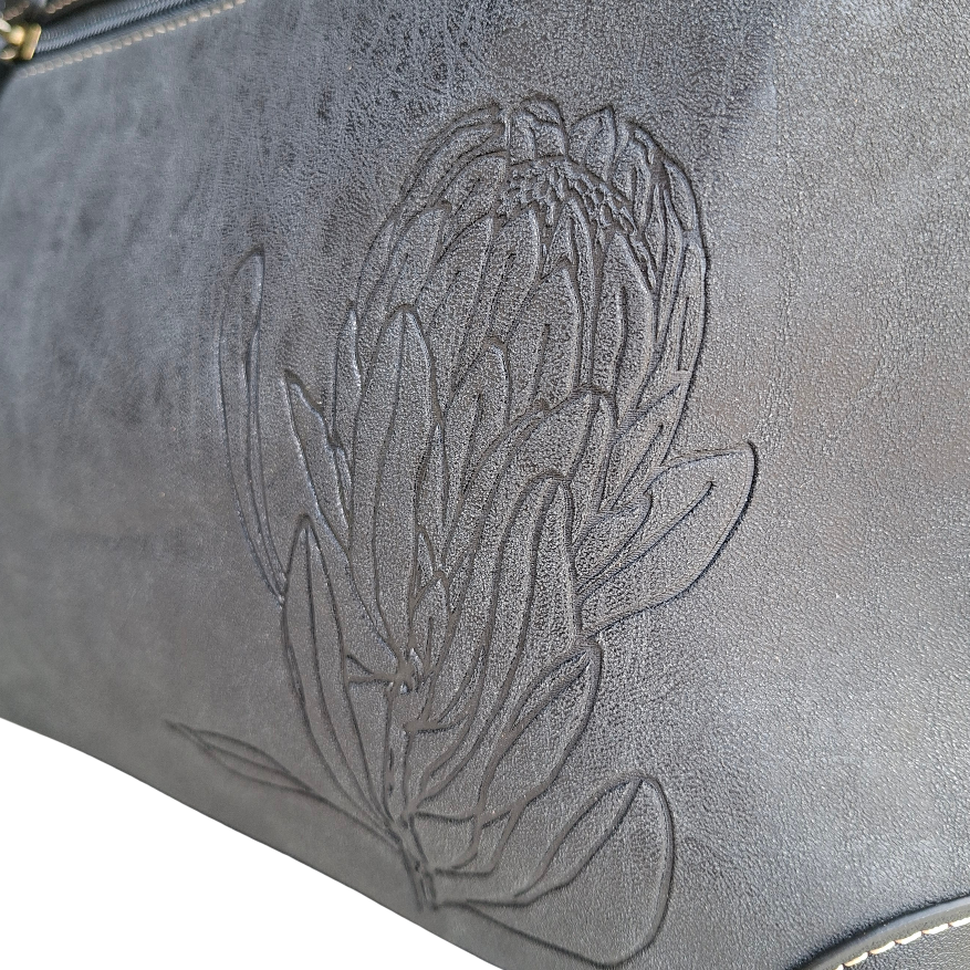Cotton Road Handbag: BLACK PU Leather Double Compartment Handbag with EMBOSSED Protea DETAIL
