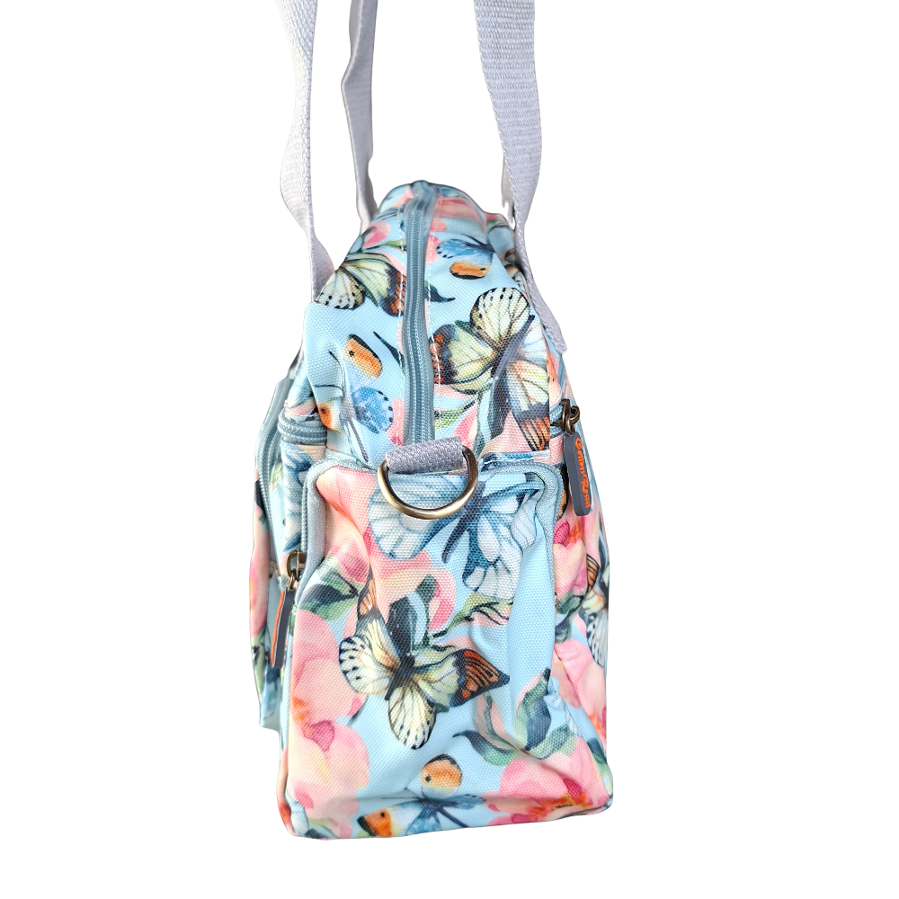 Cotton Road Handbag: LIGHT BLUE PVC with FLORAL and BUTTERFLY Print CARRY SIDE HANGING VIEW