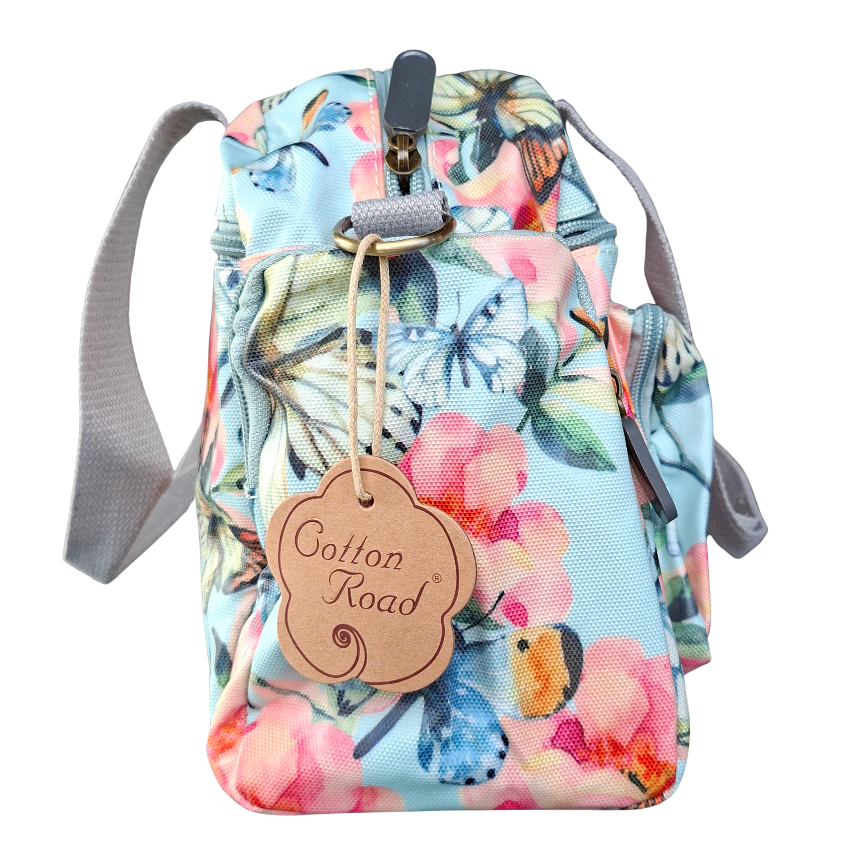 Cotton Road Handbag: LIGHT BLUE PVC with FLORAL and BUTTERFLY Print CARRY SIDE VIEW
