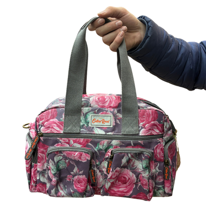Cotton Road Handbag: Purple PVC with pink roses Print FRONT