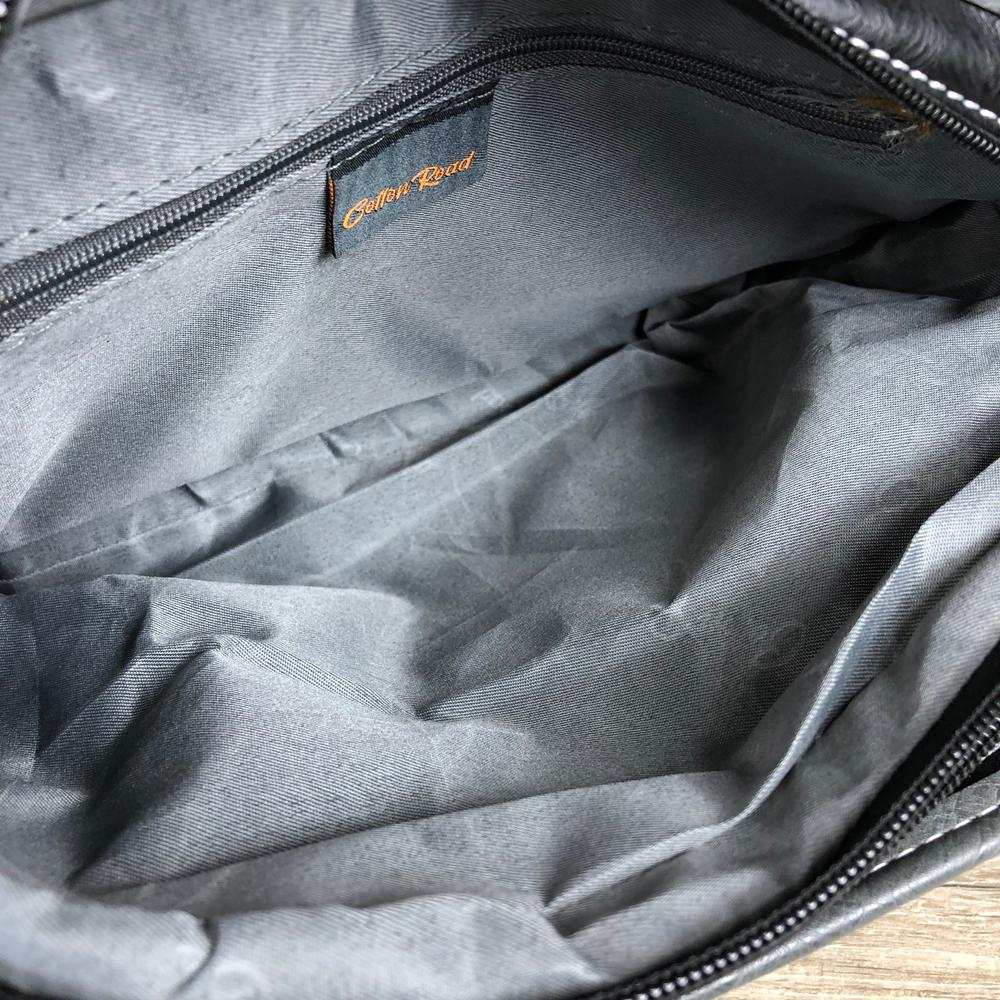 Cotton Road Sling Bag: BLACK PU Leather Bag with brown Trim and embossed Windmill set inside