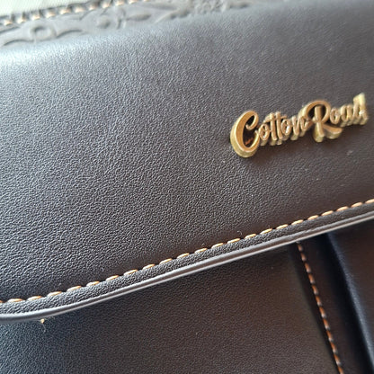 Cotton Road Sling Bag: BLACK PU Leather Crossbody with Embossed Flowers and BRANDED STRAP DETAIL