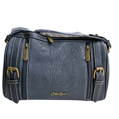 Cotton Road Sling Bag: BLACK PU Leather with Embossed PROTEA and BRANDED Strap BACK