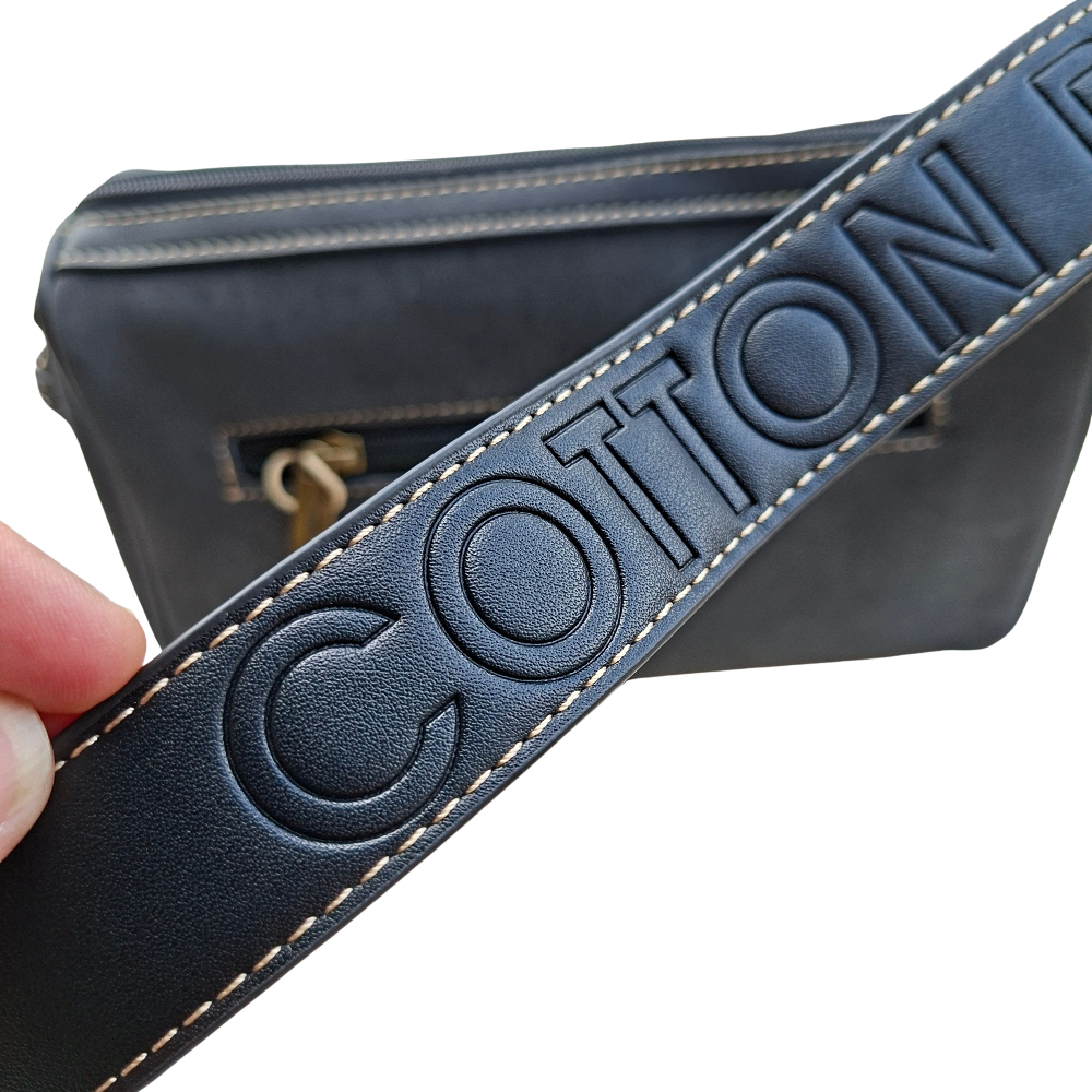 Cotton Road Sling Bag: BLACK PU Leather with Embossed PROTEA and BRANDED Strap DETAIL