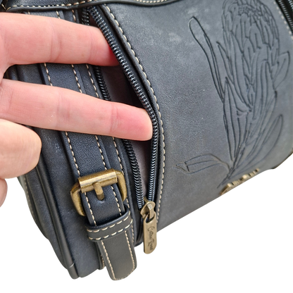 Cotton Road Sling Bag: BLACK PU Leather with Embossed PROTEA and BRANDED Strap FRONT COMPARTMENT