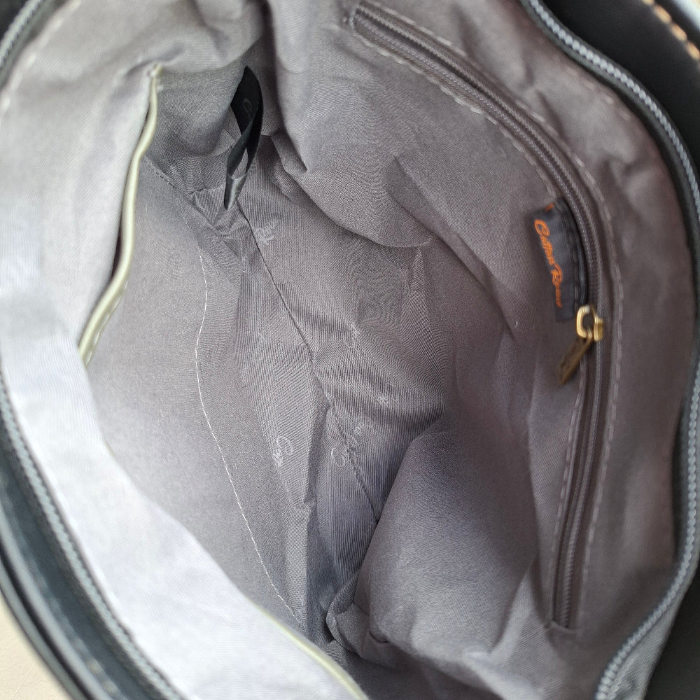 Cotton Road Sling Bag: BLACK PU Leather with Embossed Protea inside main pocket