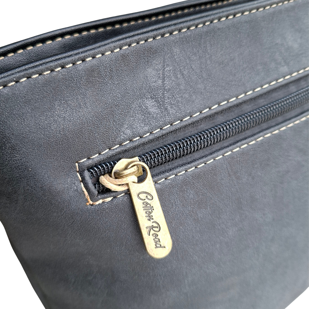 Cotton Road Sling Bag: BLACK PU Leather with Embossed Protea rear zip view