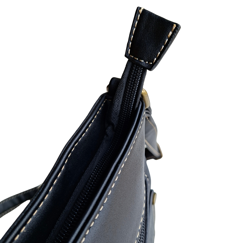 Cotton Road Sling Bag: BLACK PU Leather with Embossed Protea top zipped pocket