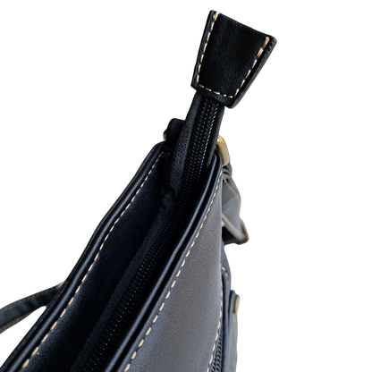 Cotton Road Sling Bag: BLACK PU Leather with Embossed Protea top zipped pocket