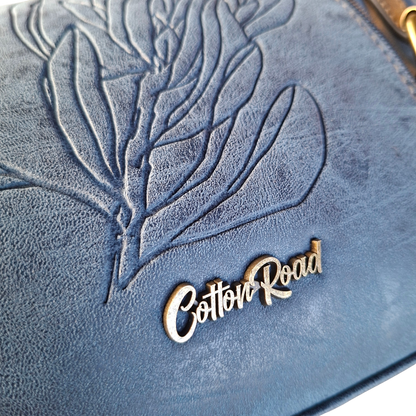 Cotton Road Sling Bag: BLUE PU Leather with Embossed PROTEA and BRANDED Strap BRANDING DETAIL