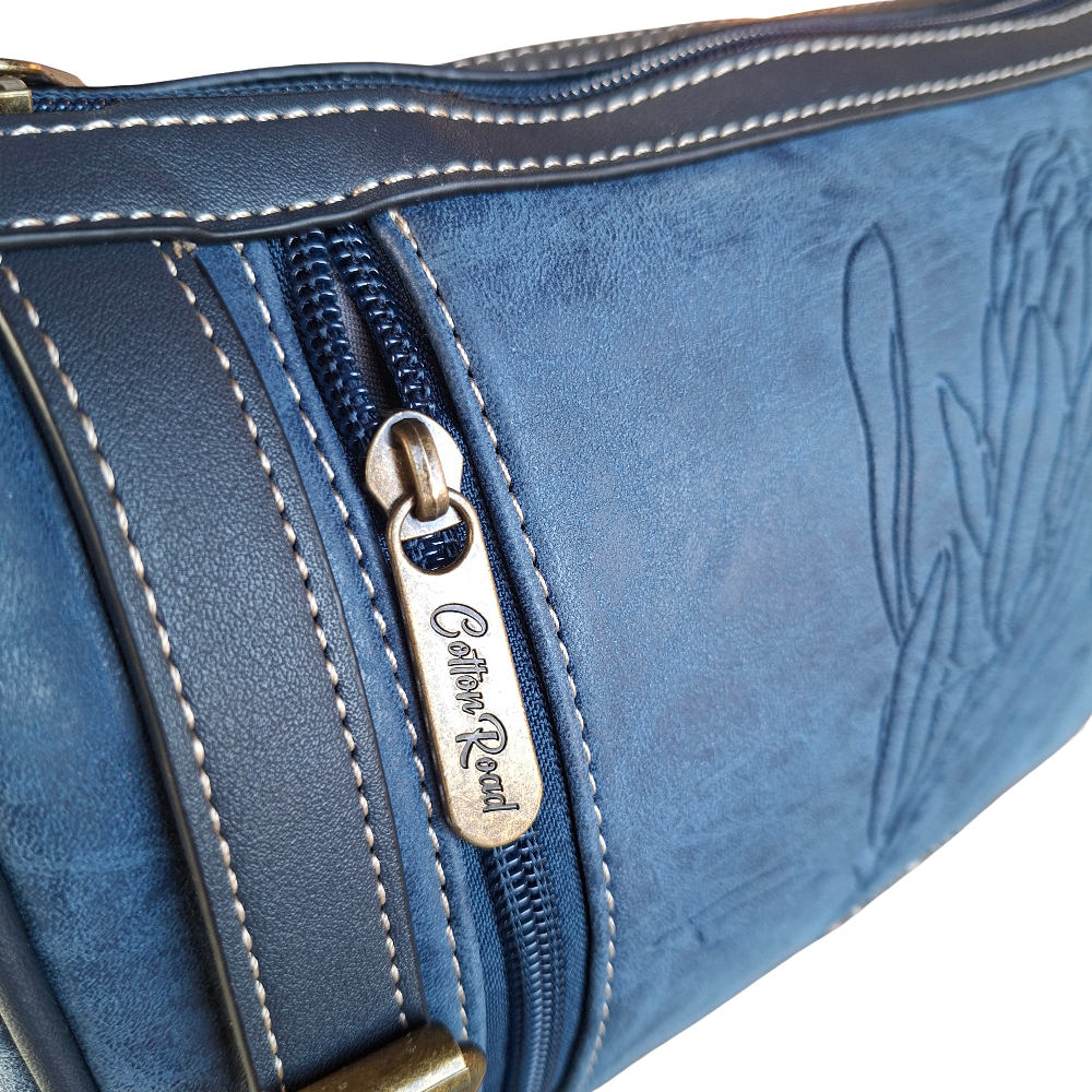 Cotton Road Sling Bag: BLUE PU Leather with Embossed PROTEA and BRANDED Strap DETAIL