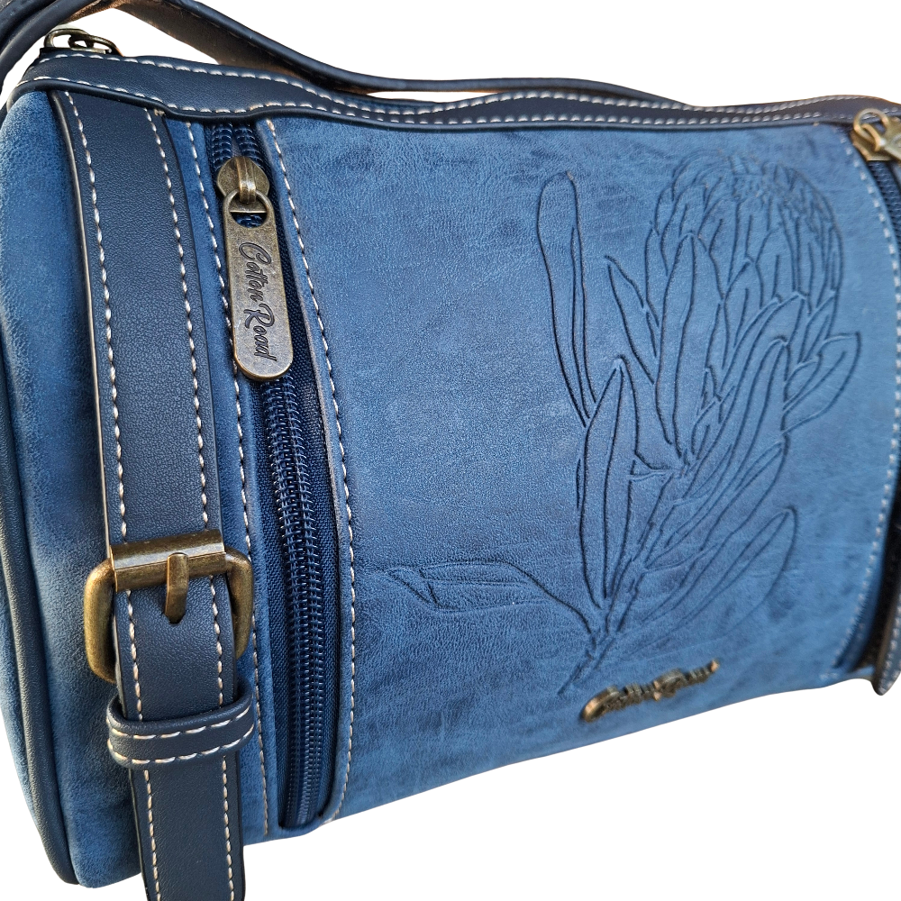 Cotton Road Sling Bag: BLUE PU Leather with Embossed PROTEA and BRANDED Strap DETAILING