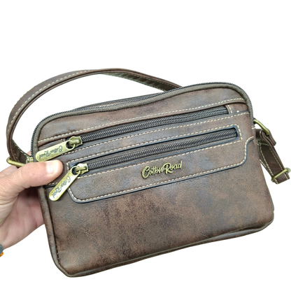 Cotton Road Sling Bag: COFFEE BROWN PU Leather Crossbody with Adjustable Strap FRONT IN HAND VIEW