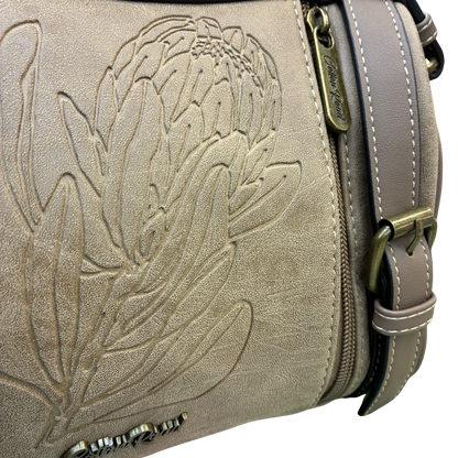 Cotton Road Sling Bag: KHAKI PU Leather with Embossed Protea and BRANDED Strap DETAIL