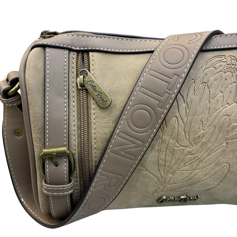 Cotton Road Sling Bag: KHAKI PU Leather with Embossed Protea and BRANDED Strap DETAIL VIEW